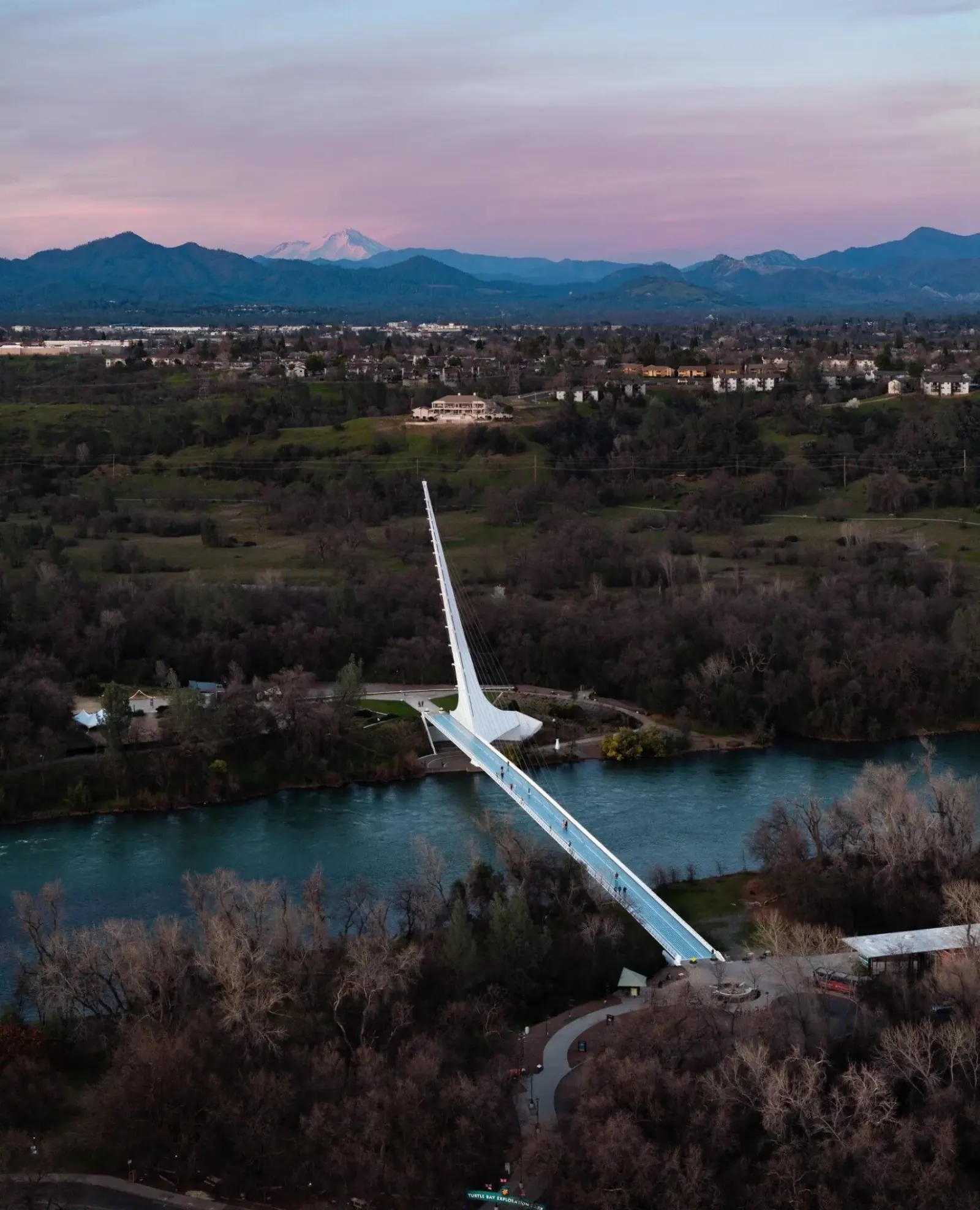 Sundial Bridge over the Sacramento River in Redding with Mount Shasta at sunset